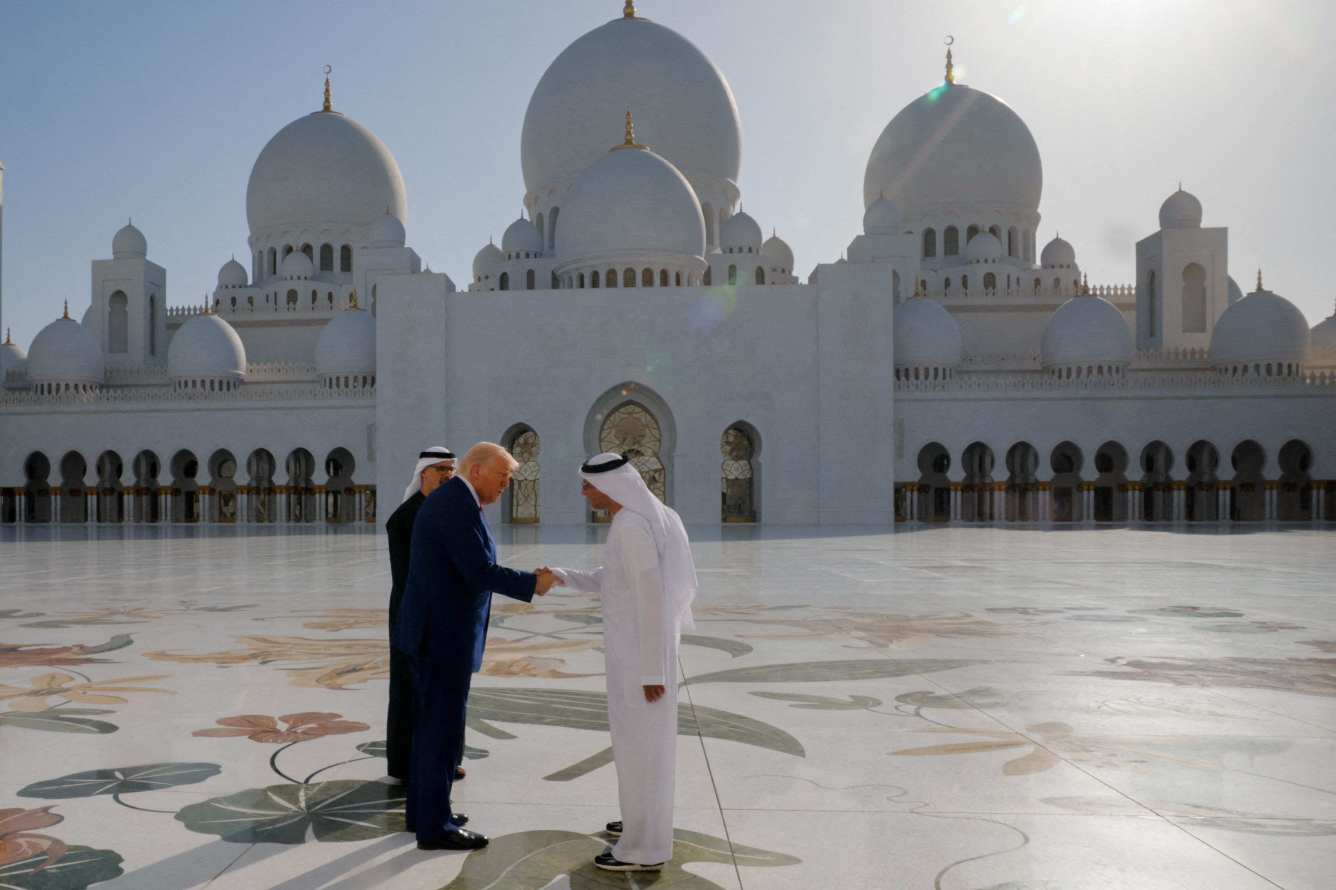 US President Donald Trump shakes hands with Yousif Al Obaidli, director of Sheikh Zayed Grand Mosque.