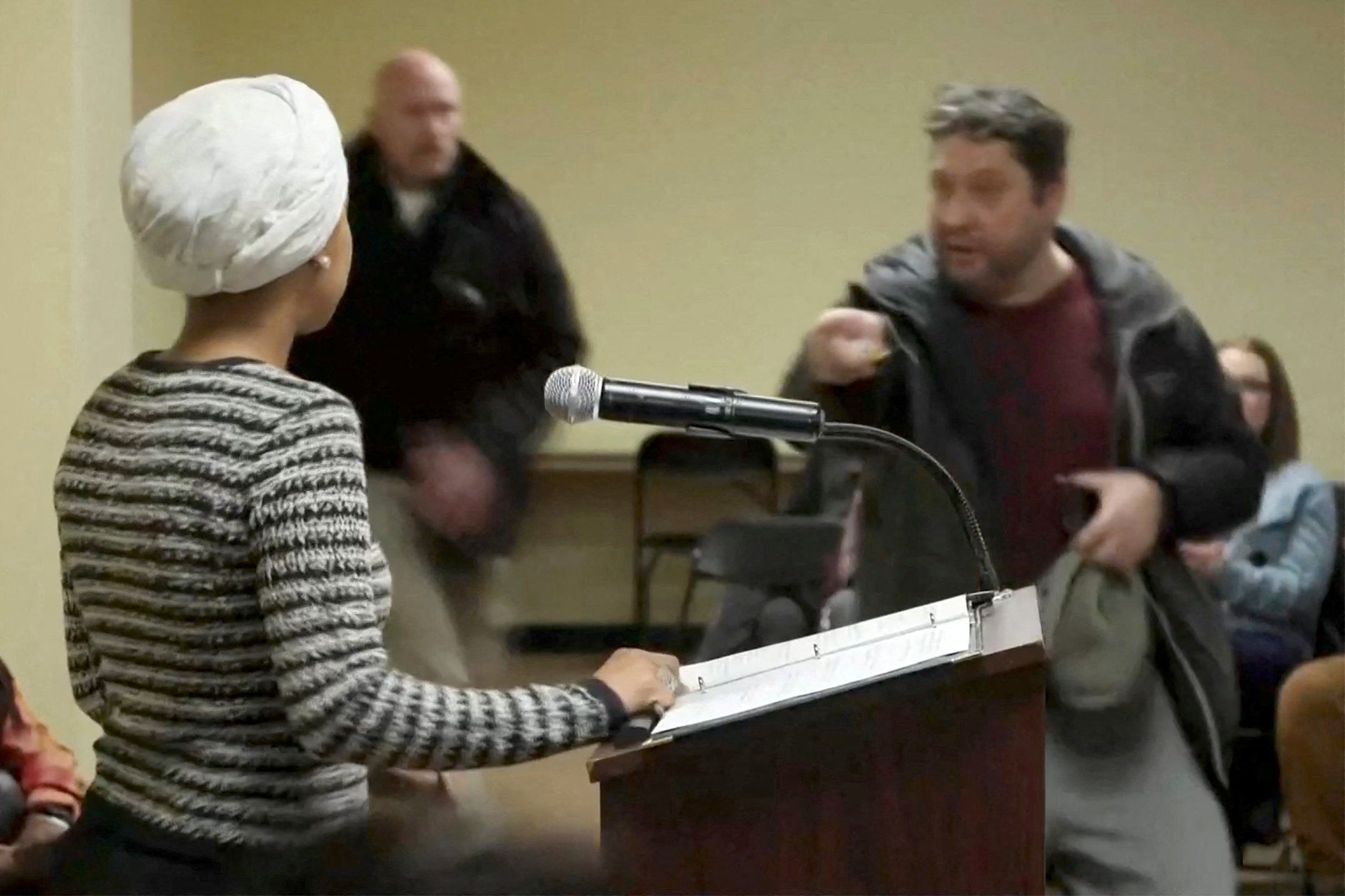 Moments after a person sprayed Ilhan Omar at a town hall. 