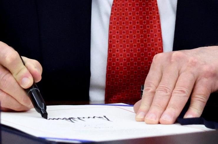 Donald Trump signing the bill ending the shutdown