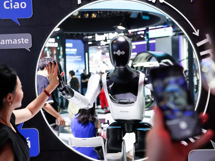 People interact with a robot at the Shanghai Artificial Intelligence conference