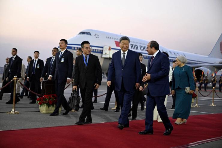 China’s President Xi Jinping walks with his his Egyptian counterpart Abdel Fattah al-Sisi.