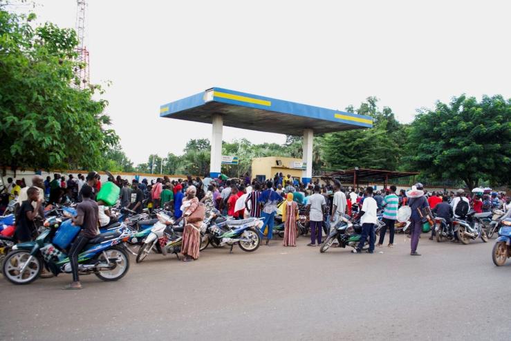 People gather at a petrol station due to a shortage of petrol in Bamako, Mali.