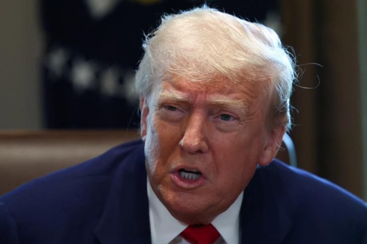 US President Donald Trump speaks during a cabinet meeting at the White House in Washington DC