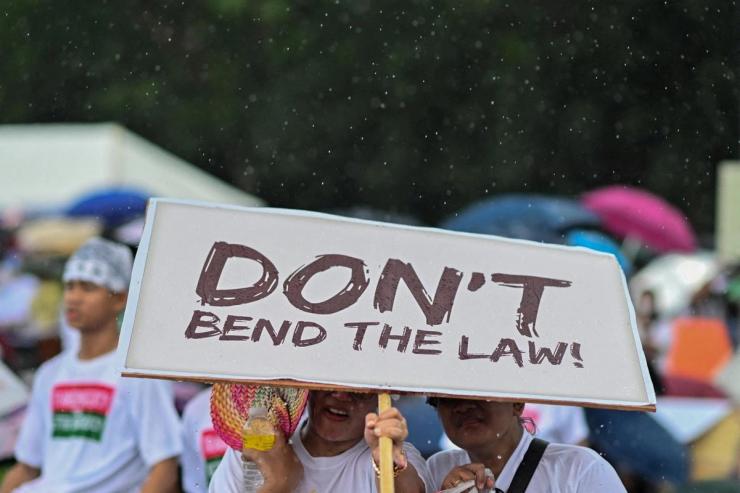 People protesting against corruption in Manila.