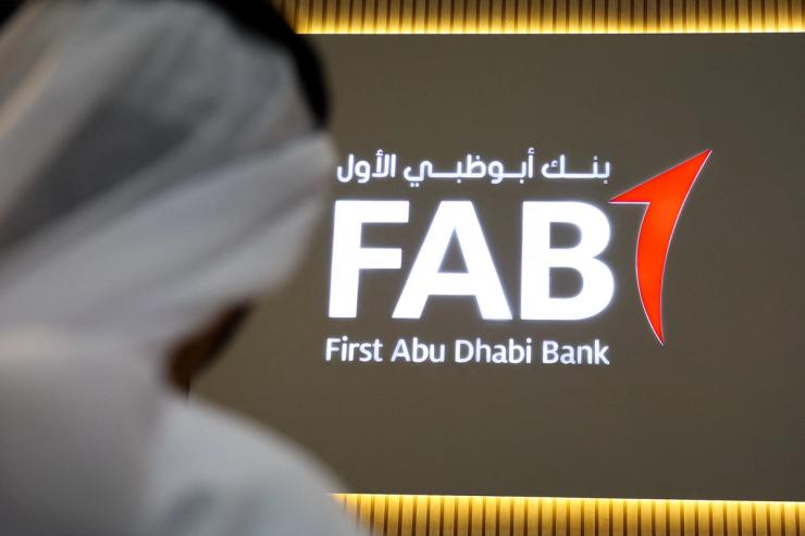 A logo of First Abu Dhabi Bank (FAB) is displayed at the Make it in the Emirates (MIITE) conference, in Abu Dhabi.