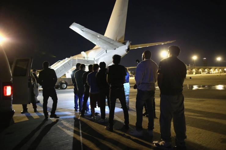 Undocumented immigrants wait to be loaded onto an Immigration and Customs Enforcement (ICE) charter jet in Arizona, US.