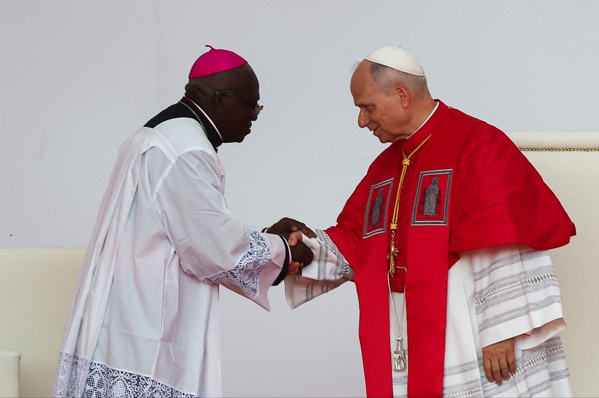 Pope Leo XIV shakes hands with Bishop Monsignor Emilio Sumbelelo in Muxima, Angola on 19 April 2026. 