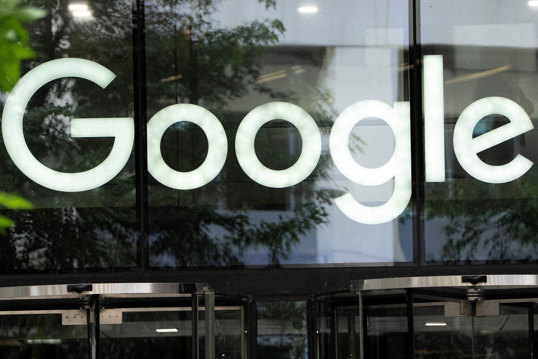 The Google logo is seen outside the company’s offices in London. 