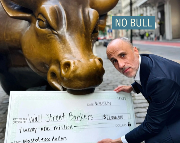 Drew Warshaw holding a check next to Wall Street’s bronze bull.