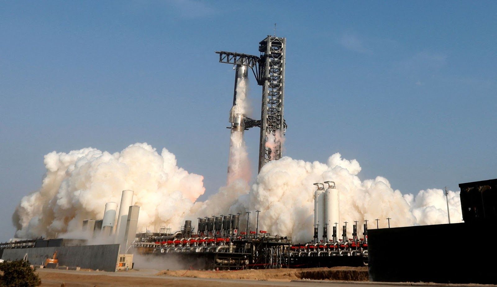 SpaceX’s next-generation Starship spacecraft atop its Super Heavy booster is launched on its ninth test at the company’s launch pad in Starbase.