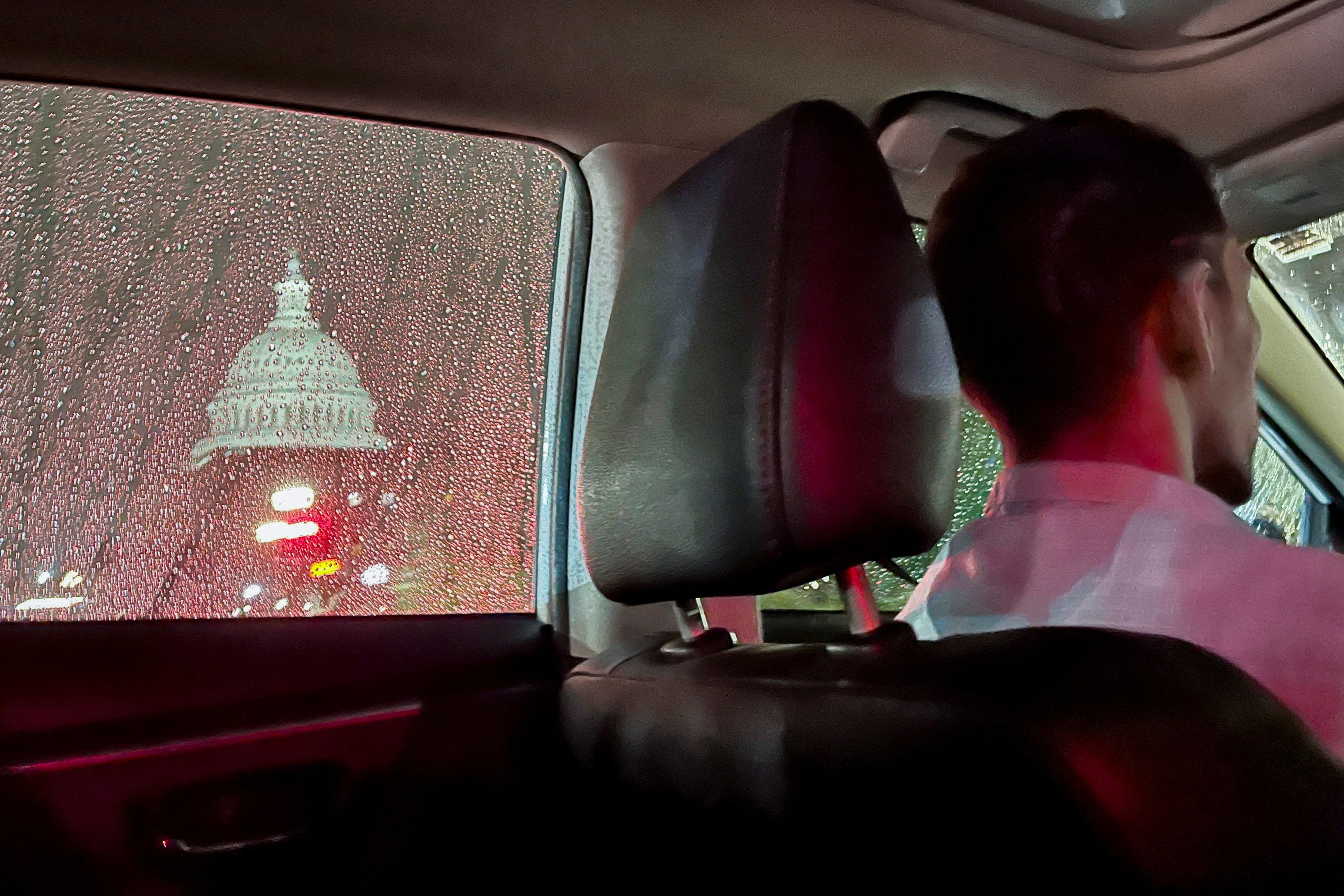 A rideshare driver passes the US Capitol dome