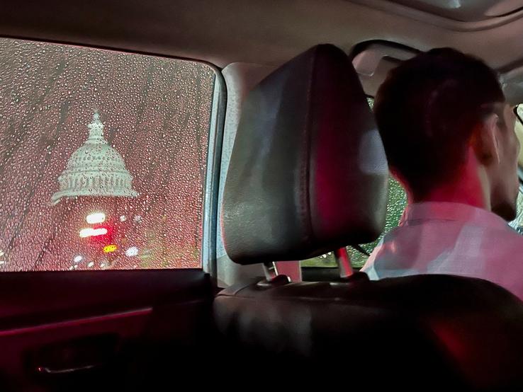 A rideshare driver passes the US Capitol dome