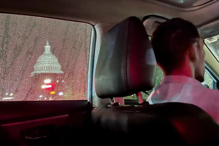 A rideshare driver passes the US Capitol dome