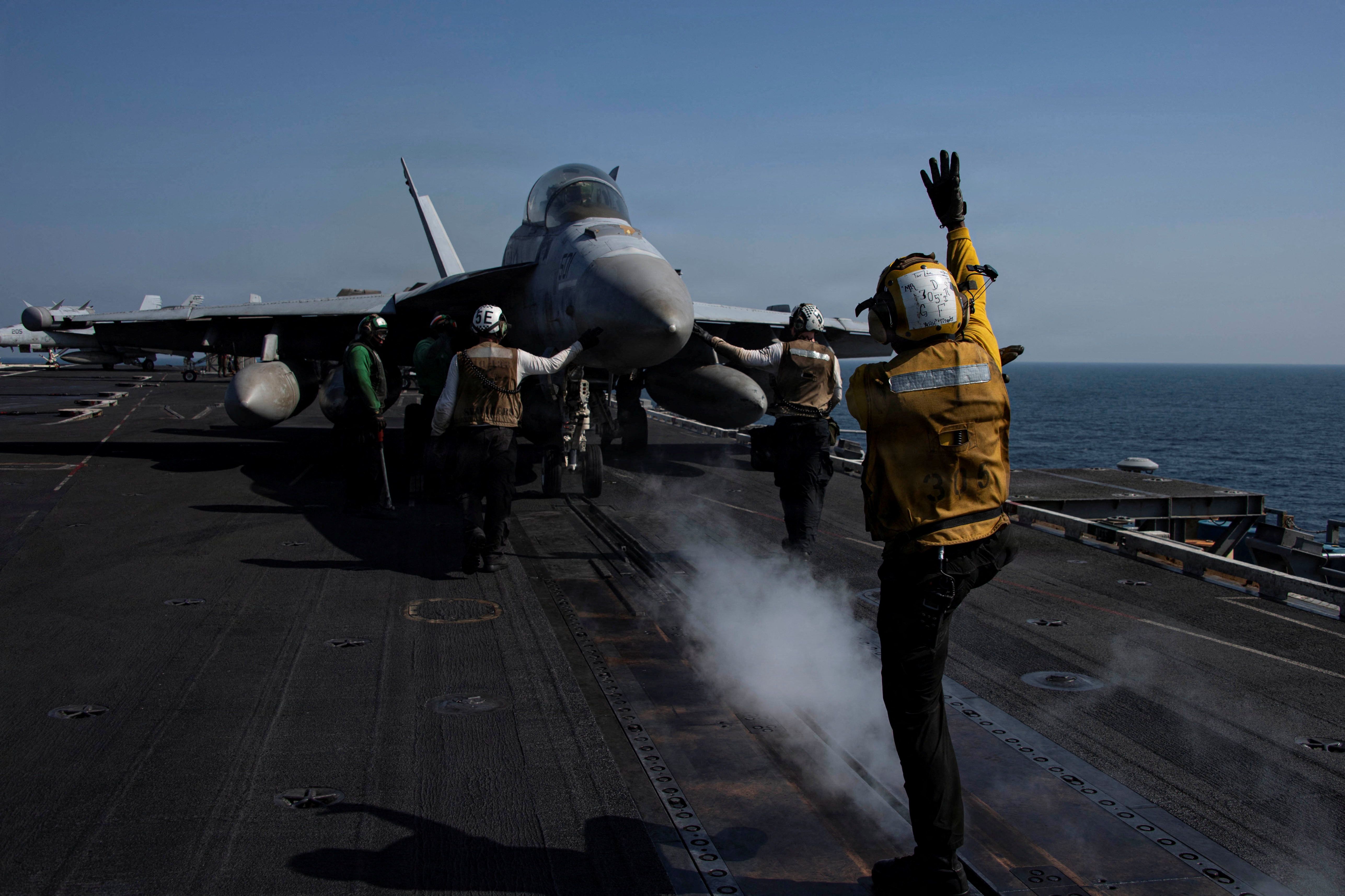 An EA-18G Growler prepares to launch from the flight deck of the U.S. Navy Nimitz-class aircraft carrier USS Abraham Lincoln in support of the Operation Epic Fury attack on Iran from an undisclosed location