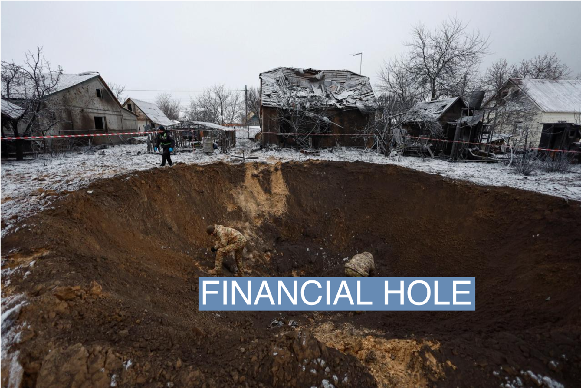 Police officers collect parts of a missile inside a crater after a Russian strike on Kyiv on Dec. 11.
