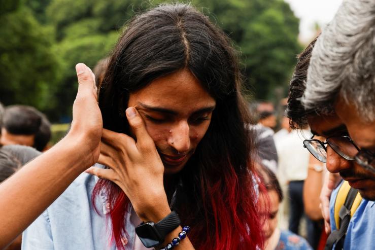 A member of the lesbian, gay, bisexual and transgender (LGBT) community reacts on the day of the verdict on same-sex marriage by the Supreme Court in New Delhi, India, October 17, 2023. REUTERS/Anushree Fadnavis