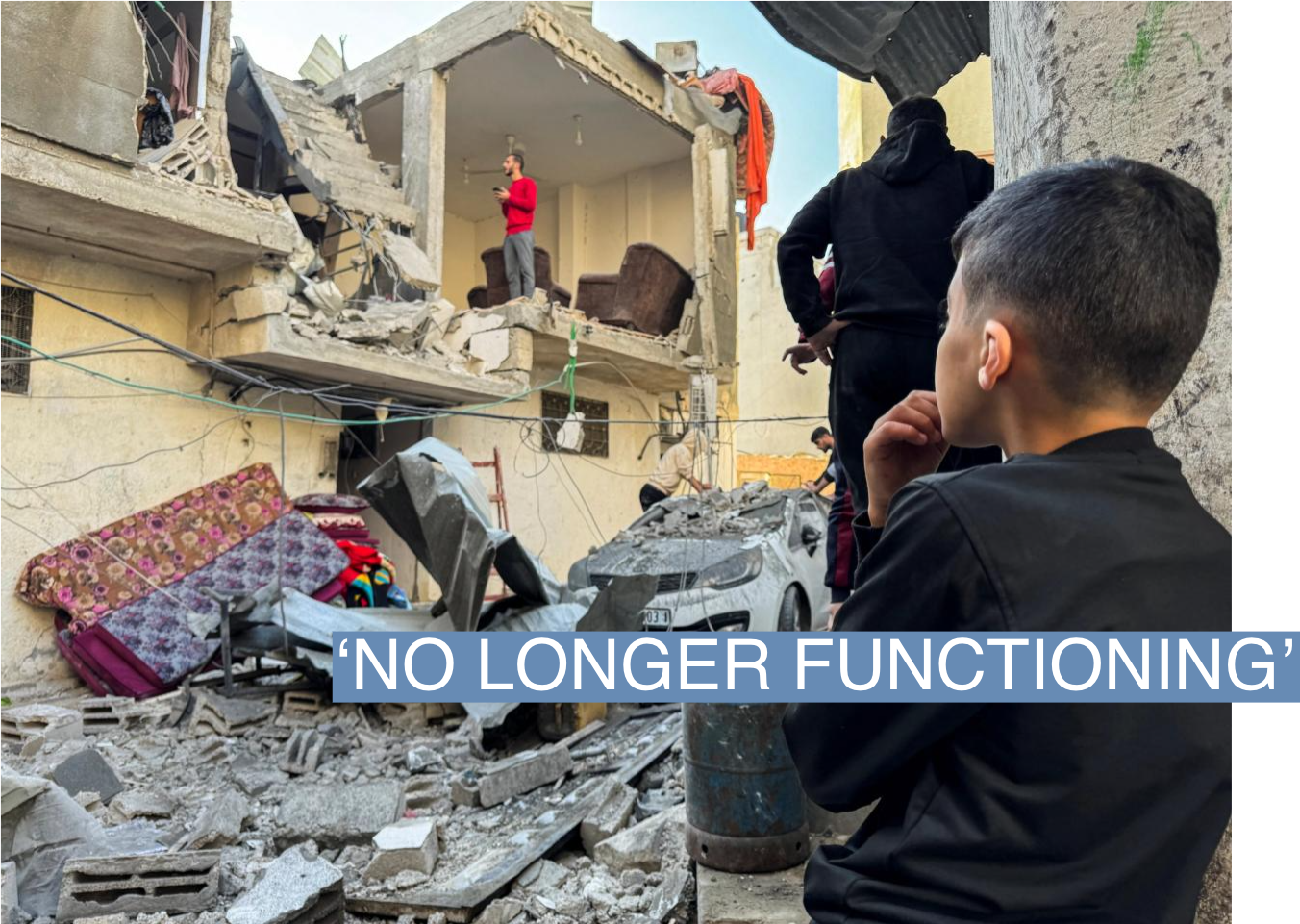 A Palestinian boy looks on at the site of Israeli strikes on a house, amid the ongoing conflict between Israel and Palestinian Islamist group Hamas, in Khan Younis in the southern Gaza Strip, December 8, 2023. REUTERS/Bassam Masoud