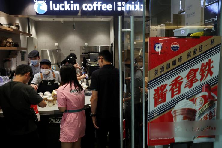 An advertisement promoting a Kweichow Moutai liquor latte is seen at a Luckin Coffee store in Beijing, China, Sept. 4, 2023.