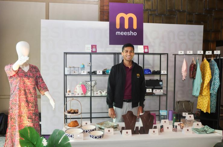 Vidit Aatrey, Chairman, Managing Director and Chief Executive Officer of Meesho Limited, an e-commerce marketplace, poses for pictures with products during its IPO announcement press conference, in Mumbai, India.
