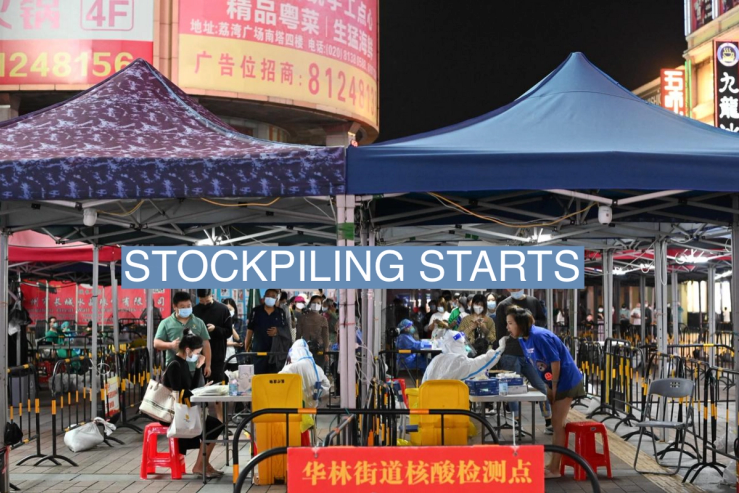 People line up to take nucleic acid test for the coronavirus disease (COVID-19) following the outbreak, at a makeshift testing site in Guangzhou, Guangdong province, China
