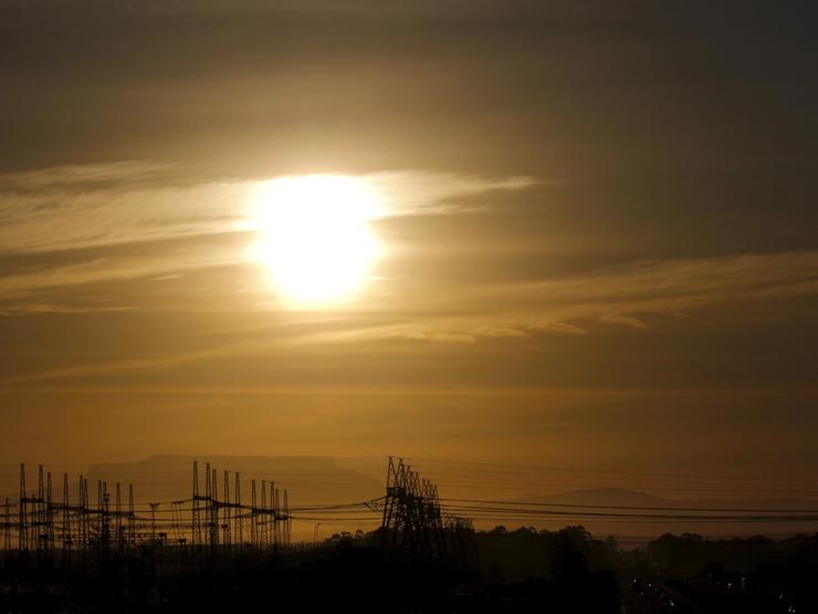 Pylons carry electricity from South African power utility Eskom’s Koeberg nuclear plant near Cape Town on Nov. 28, 2015.