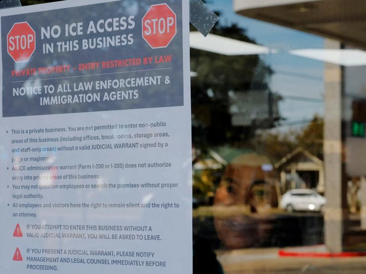 Sign in a business’ window telling ICE not to enter