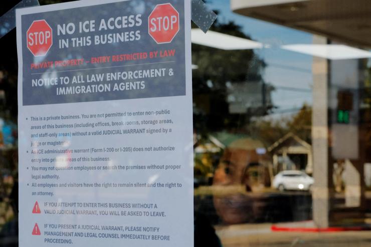 Sign in a business’ window telling ICE not to enter