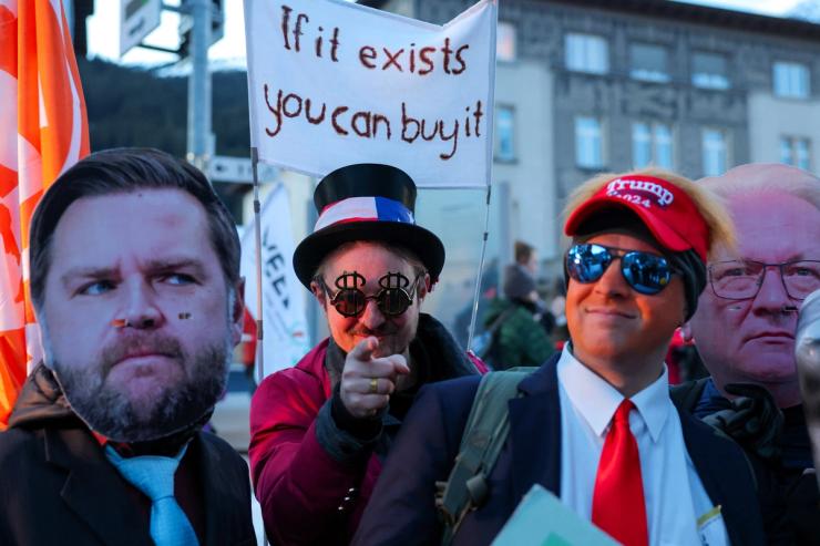 Activists wearing masks of Rheinmetall CEO Armin Papperger and US Vice President JD Vance.
