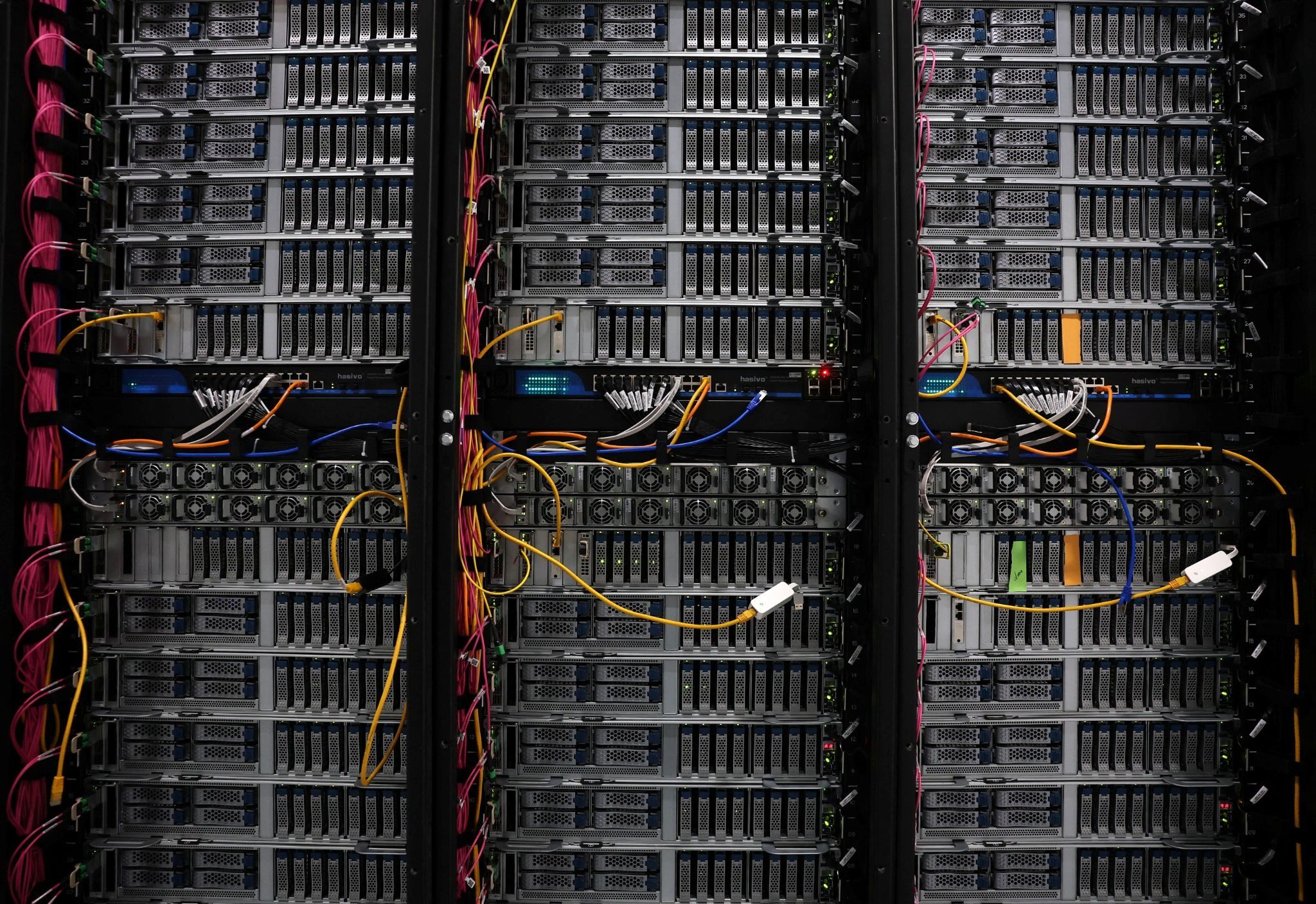 A view shows detail of racks for data servers, GPUs and CPUs inside the Nebius AI UK data centre. 