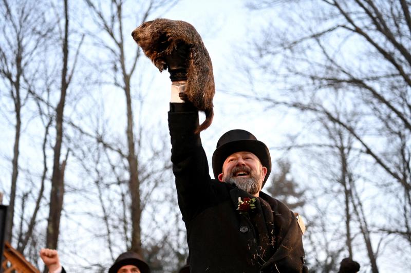 AJ Dereume holds up Phil the groundhog as he is to make his prediction on how long winter will last during the Groundhog Day Festivities, at Gobblers Knob in Punxsutawney, Pennsylvania, U.S., February 2, 2023.