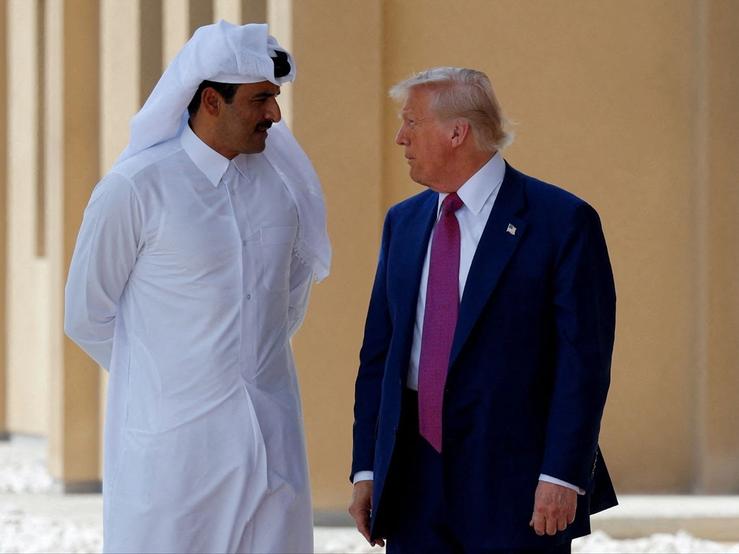 U.S. President Donald Trump talks with Qatar’s Emir Tamim bin Hamad Al Thani in Doha, Qatar, May 15