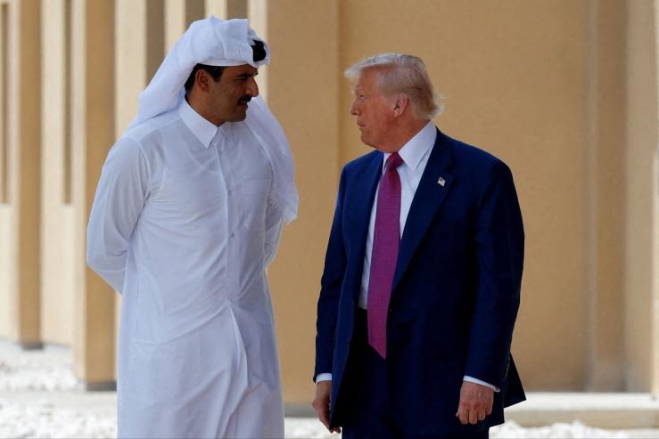 U.S. President Donald Trump talks with Qatar’s Emir Tamim bin Hamad Al Thani in Doha, Qatar, May 15