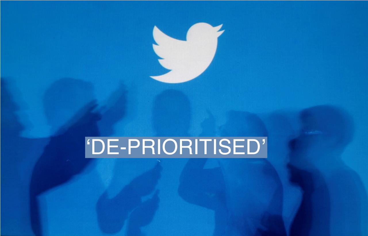 The shadows of people holding mobile phones are cast onto a backdrop projected with the Twitter logo in this illustration picture taken in Warsaw September 27, 2013. Picture taken September 27. REUTERS/Kacper Pempel