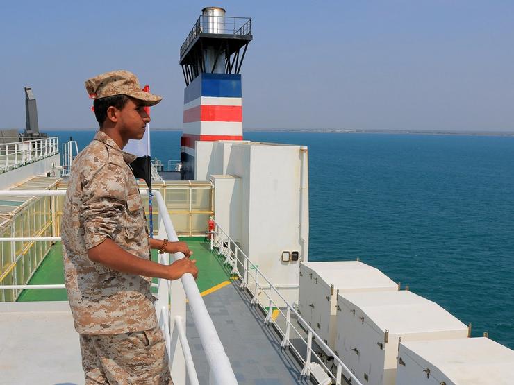 A picture taken during an organized tour by Yemen’s Huthi rebels on Nov. 22, 2023 shows a security guard aboard the Galaxy Leader cargo ship.