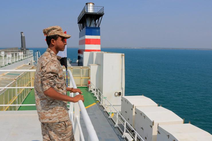 A picture taken during an organized tour by Yemen’s Huthi rebels on Nov. 22, 2023 shows a security guard aboard the Galaxy Leader cargo ship.