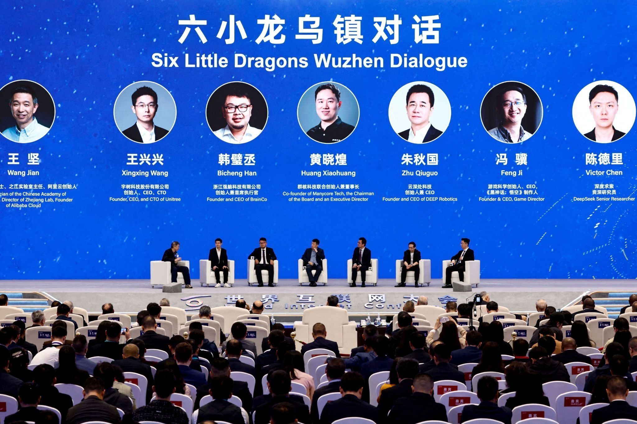 Founder, CEO and CTO of Unitree Wang Xingxing, founder and CEO of BrainCo Han Bicheng, co-founder of Manycore Tech Huang Xiaohuang, founder and CEO of DEEP Robotics Zhu Qiuguo, founder and CEO of Game Science Feng Ji, Deepseek Senior Researcher Victor Chen and founder of Alibaba Cloud Wang Jian attend the Six Little Dragons Wuzhen Dialogue, at the World Internet Conference, in Wuzhen town of Tongxiang city, Zhejiang province, China. 