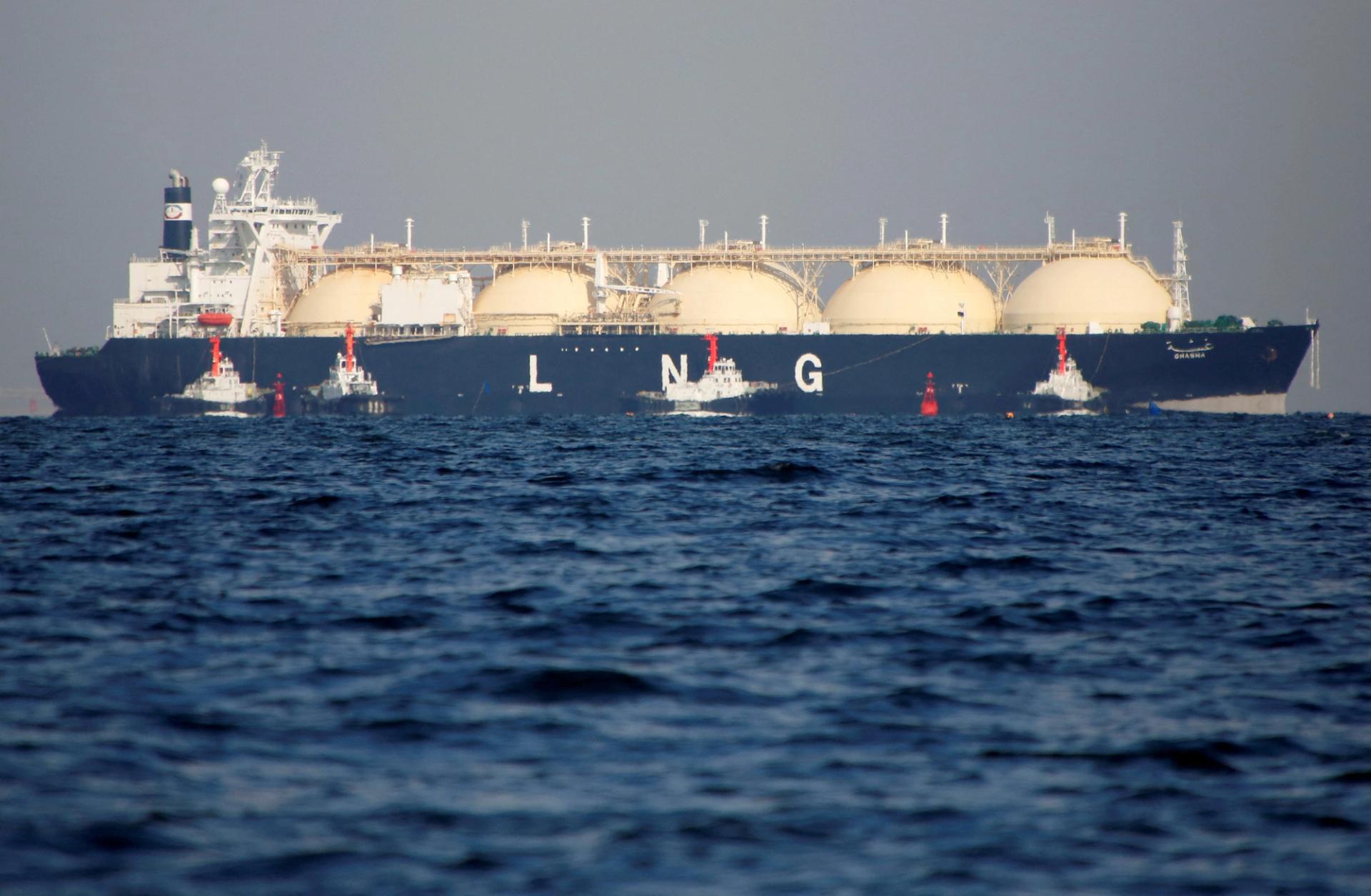 A liquefied natural gas (LNG) tanker is tugged towards a thermal power station in Futtsu, east of Tokyo.