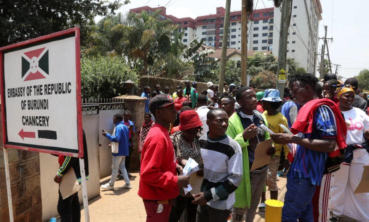 Burundi nationals stand outside their country’s embassy as they seek travel documents to return to Burundi after Kenyan President William Ruto ordered a crackdown on small-scale traders.