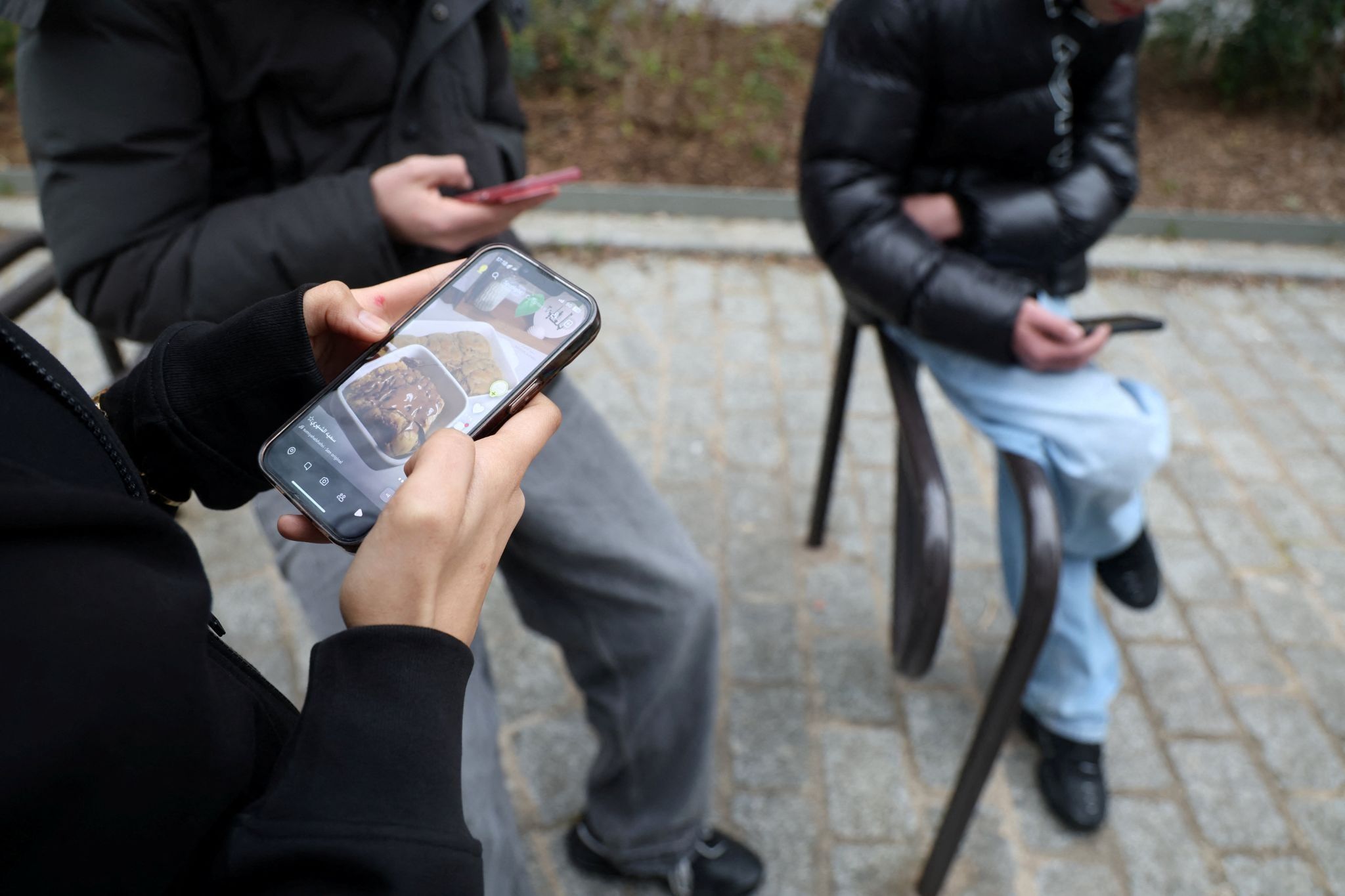 People on their phones. 