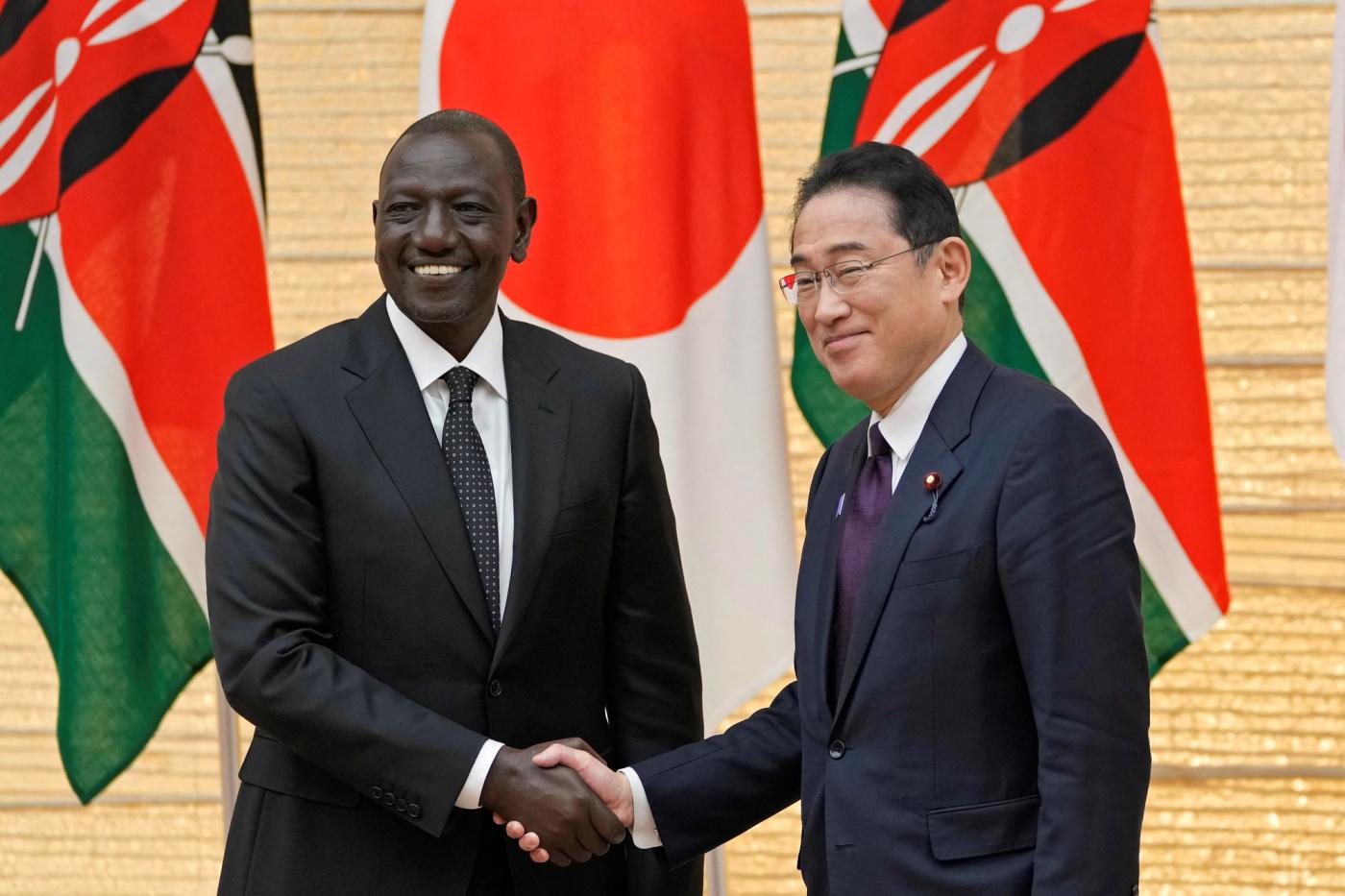 Kenyan President William Ruto and Japanese Prime Minister Fumio Kishida shake hands at the end of their joint press conference at the prime minister's office in Tokyo