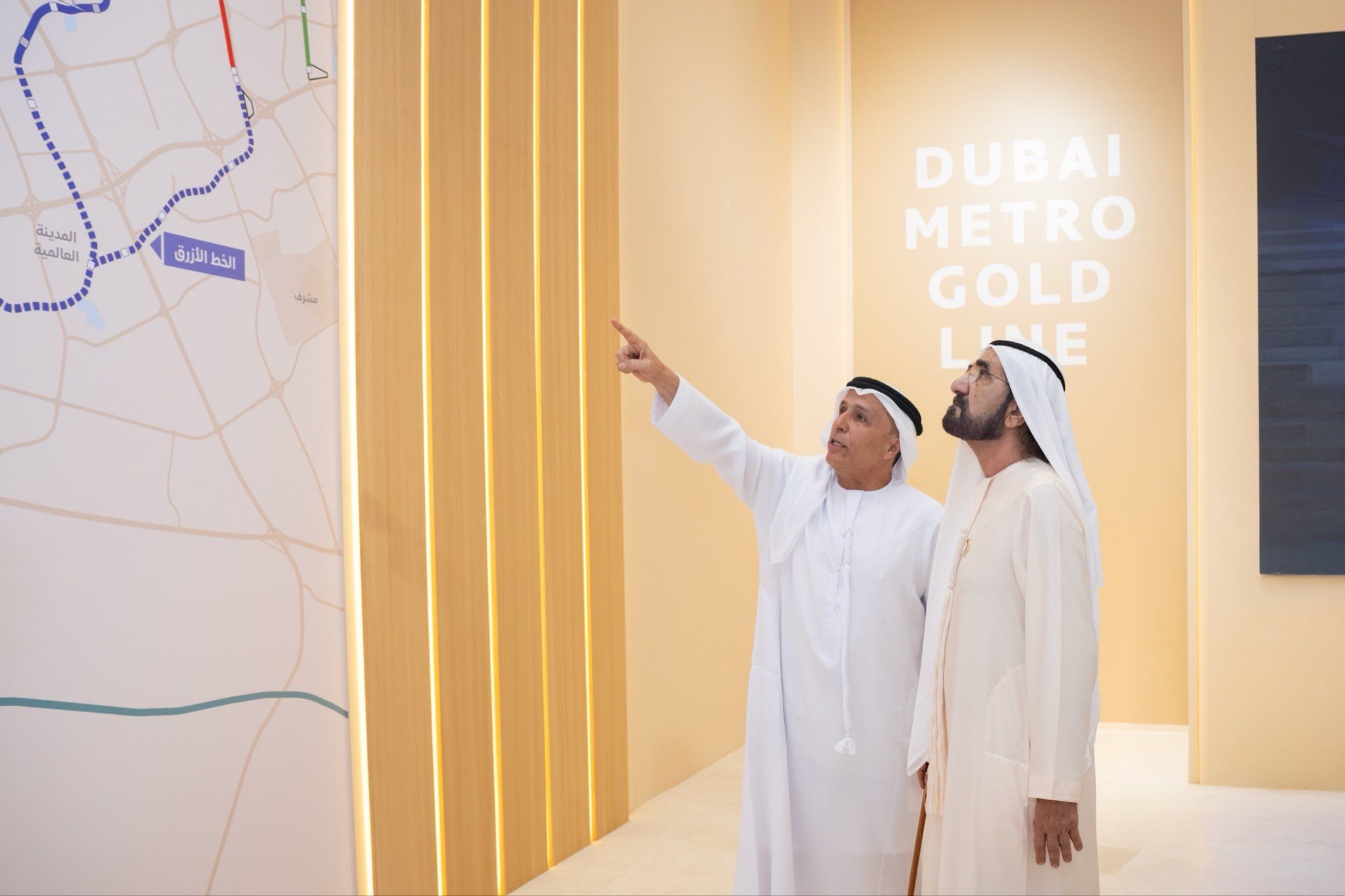 Two Dubai sheikhs look at the map for the city’s new metro system.