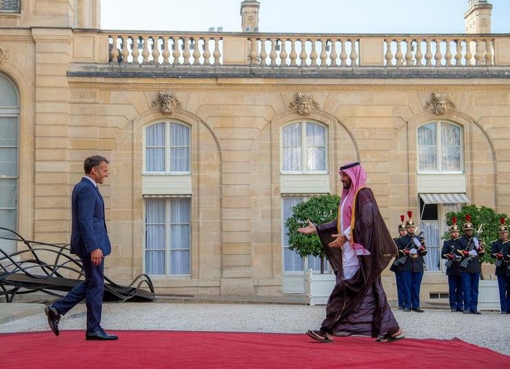 France’s President Emmanuel Macron walks towards Saudi Arabia’s Crown Prince Mohammed bin Salman at the Elysee Palace in Paris, France.
