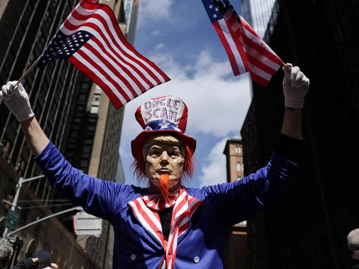 A protester dressed as “Uncle Scam”