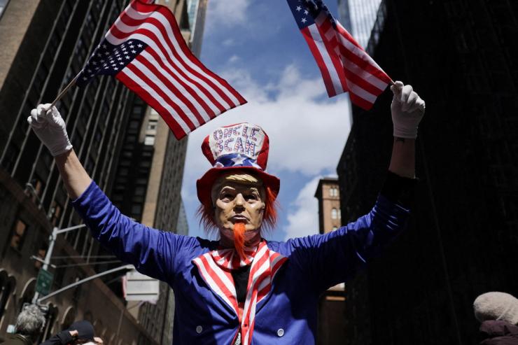 A protester dressed as “Uncle Scam”