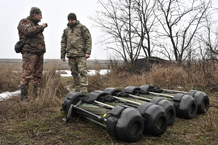 Ukrainian Armed Forces stand next to Javelin anti-tank missile systems.