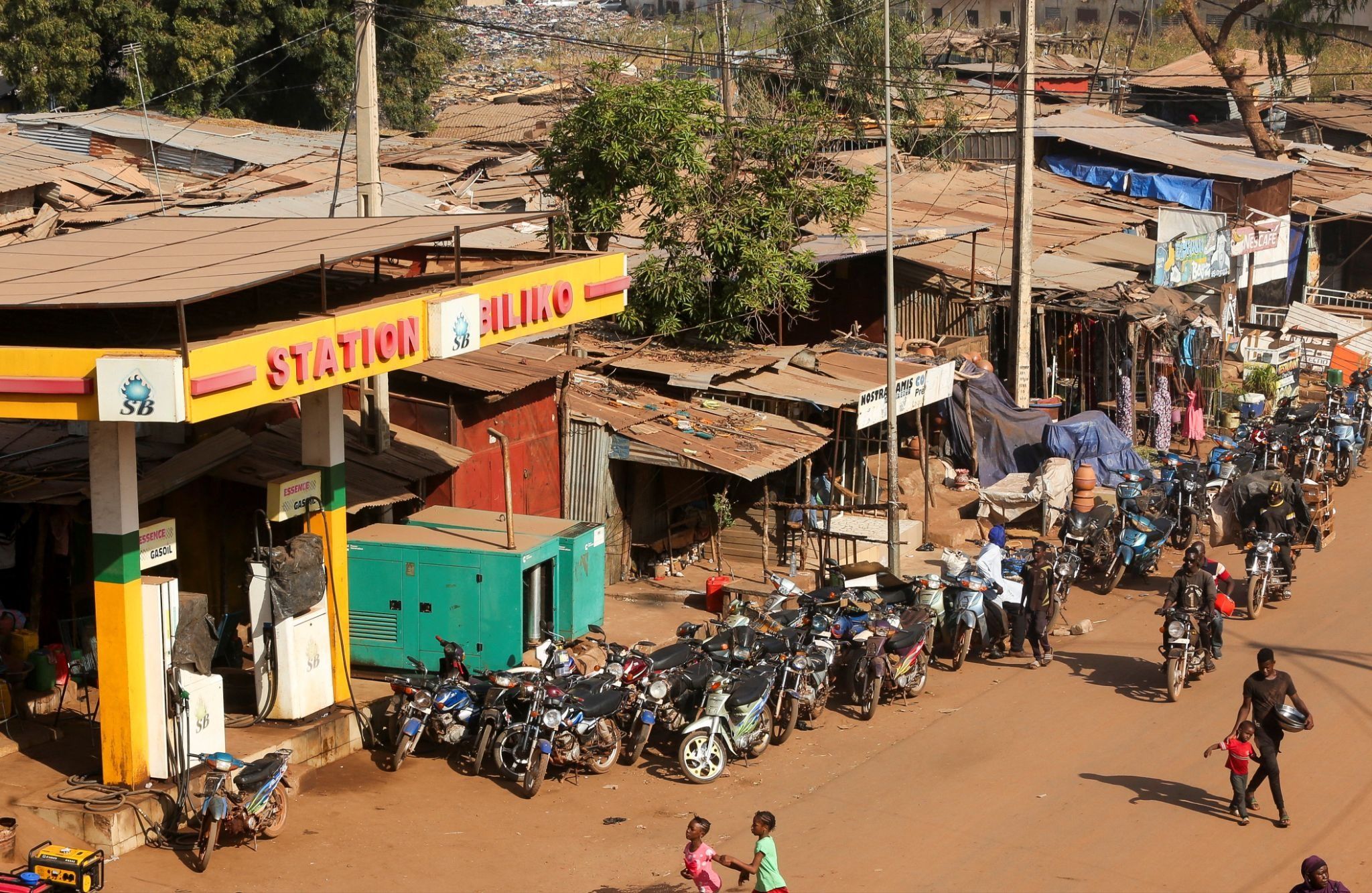 Motorcycles line up near a closed petrol station in Bamako.
