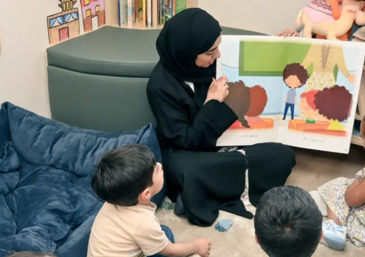 A teacher reads to students.