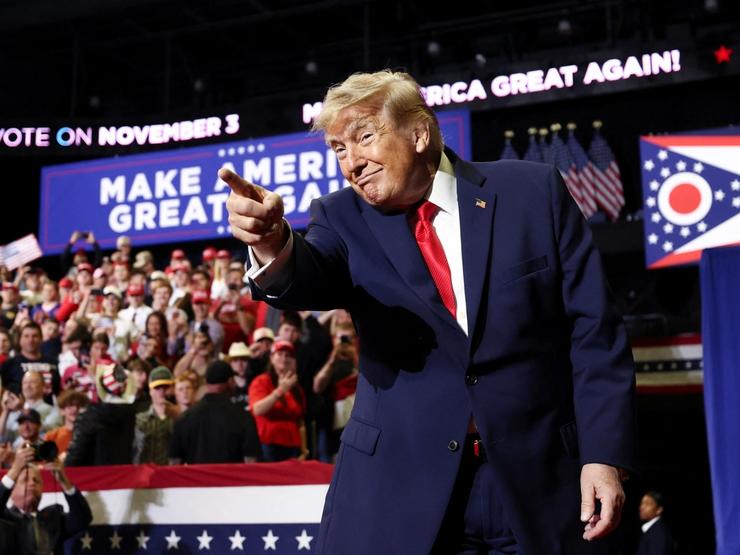 US President Donald Trump points toward supporters at the end of a campaign rally for US Senator Jon Husted (R-OH) and gubernatorial candidate Vivek Ramaswamy in Youngstown, Ohio, US, October 12, 2026.