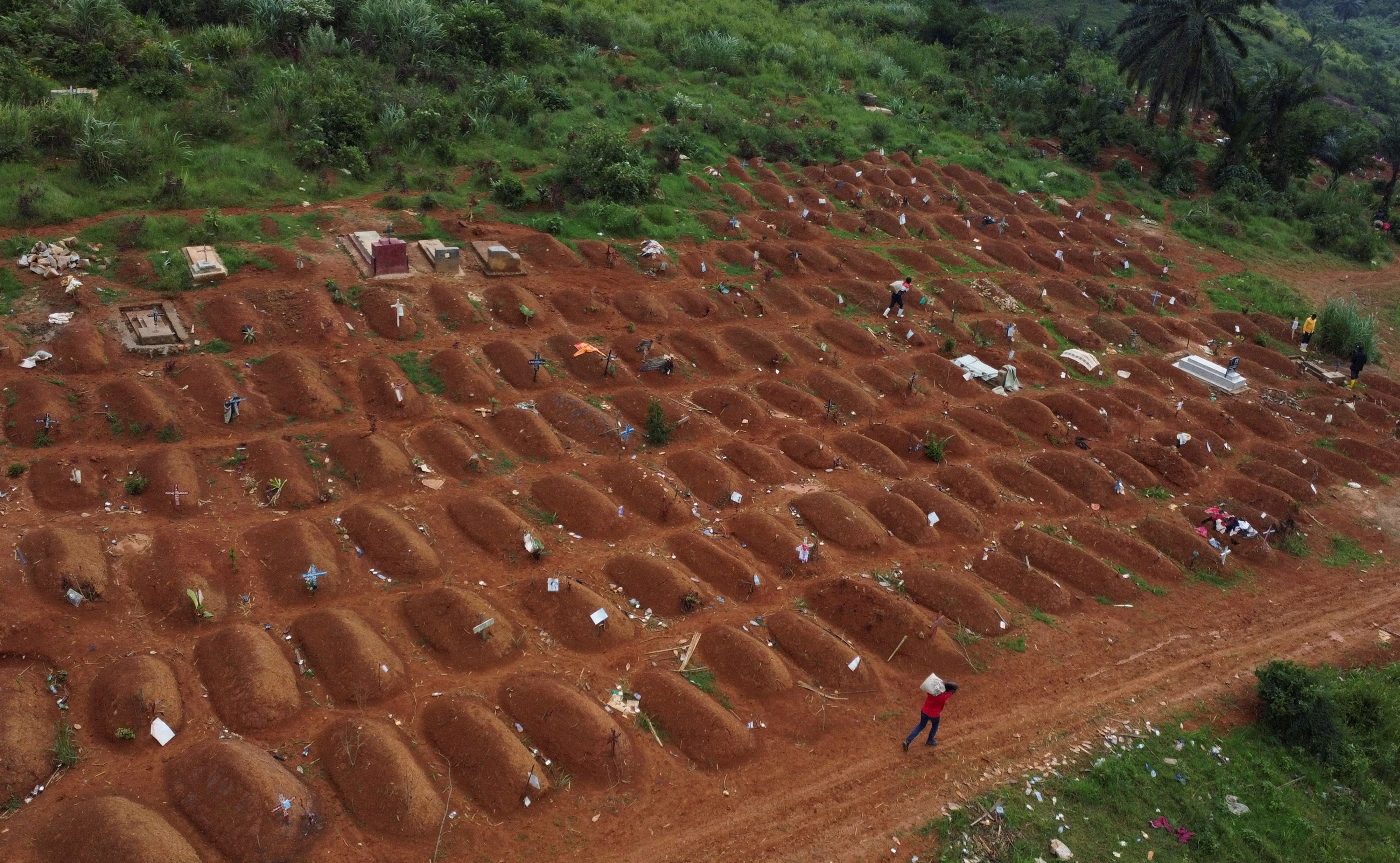 A drone view of workers at a cemetery in Ituri province, Democratic Republic of Congo