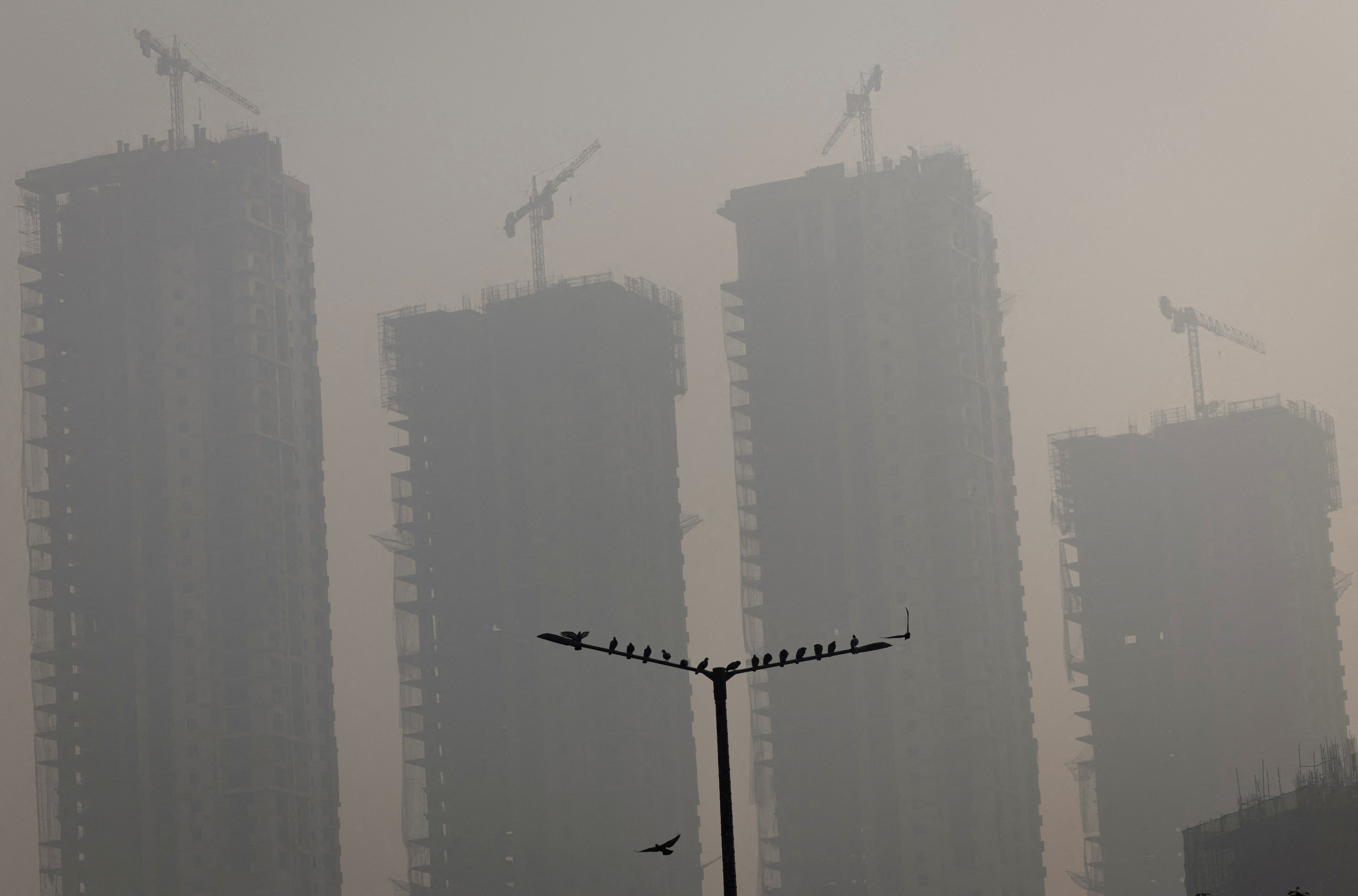 Fewer experts see climate change as global security threat, survey finds